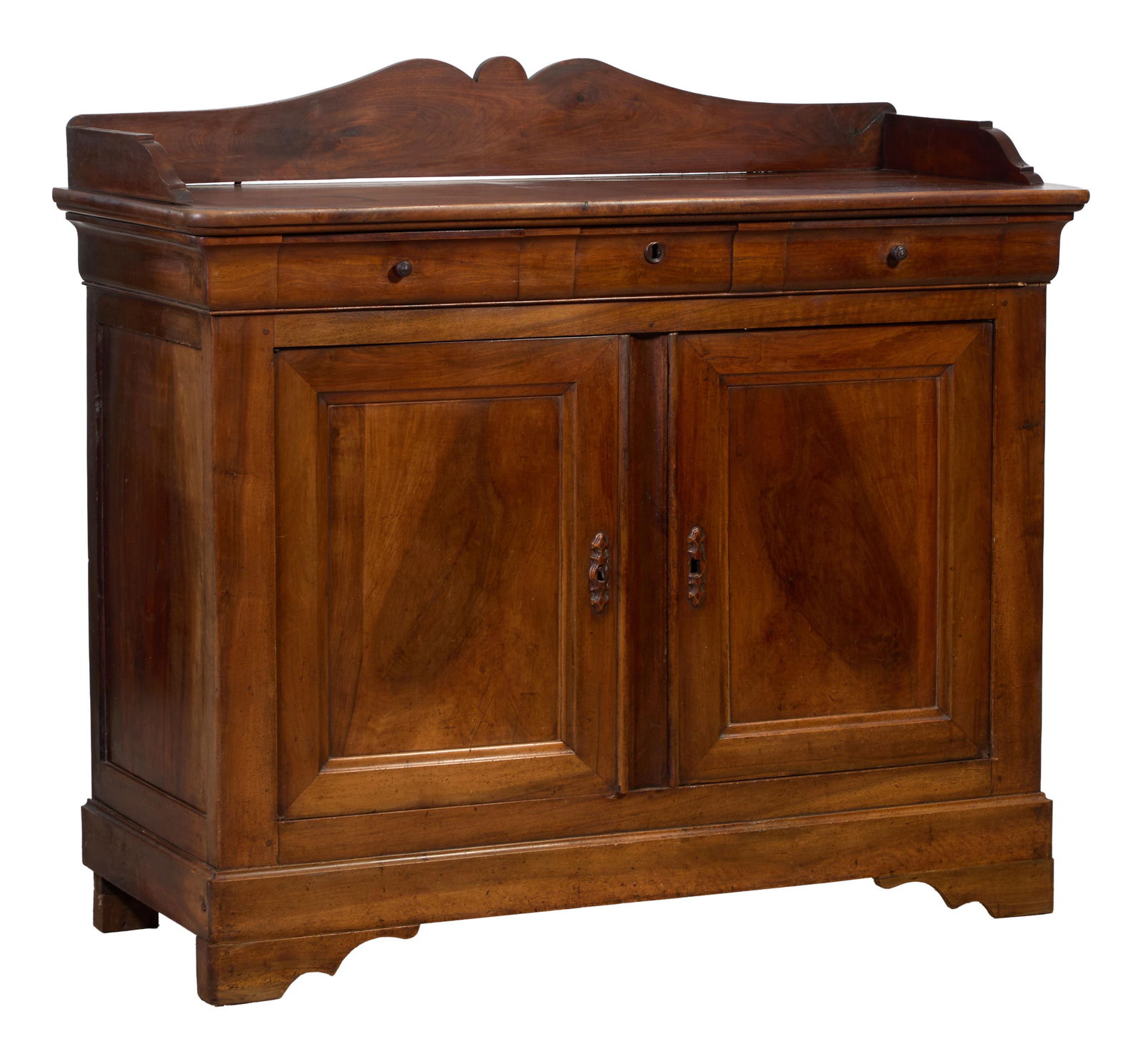 French Louis Philippe Walnut Sideboard, mid 19th c., H.- 54 1/4 in., W.- 59 1/2 in., D.- 24 1/2 in.: French Louis Philippe Walnut Sideboard, mid 19th c., the lobed gallery with downswept ends, three cyma frieze drawers, two lower cabinet doors with blocked base and bracket feet, H.- 54 1/4 in., W.- 5