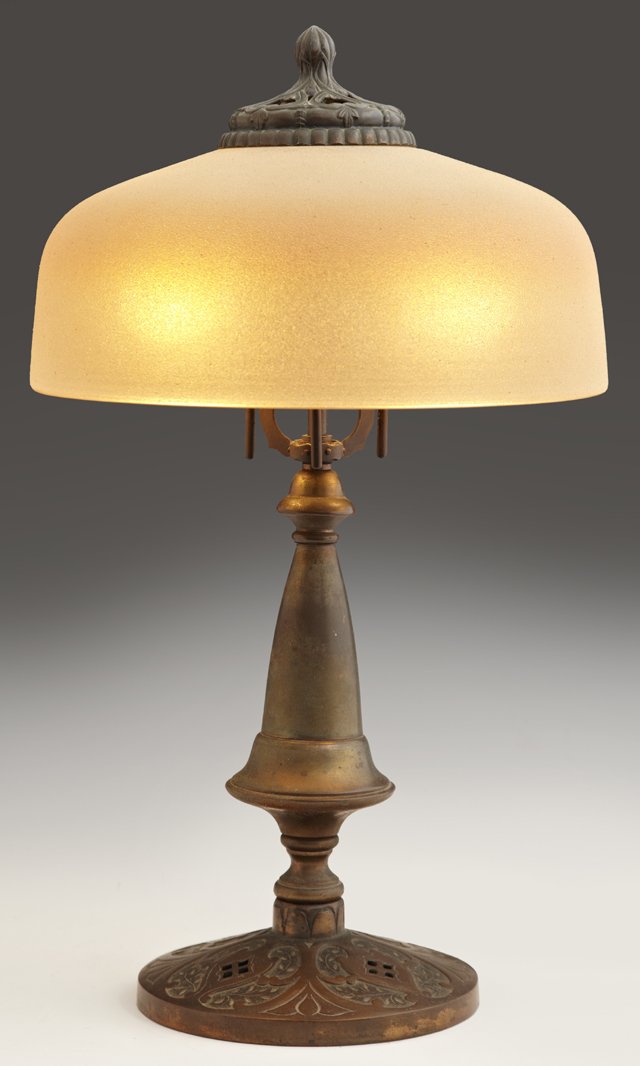 Brass and Iron Table Lamp, c. 1920, with a tapered urn: Brass and Iron Table Lamp, c. 1920, with a tapered urn support and an iridescent "chipped ice" shade, H.- 20 in., Dia.- 11 1/2 in.
