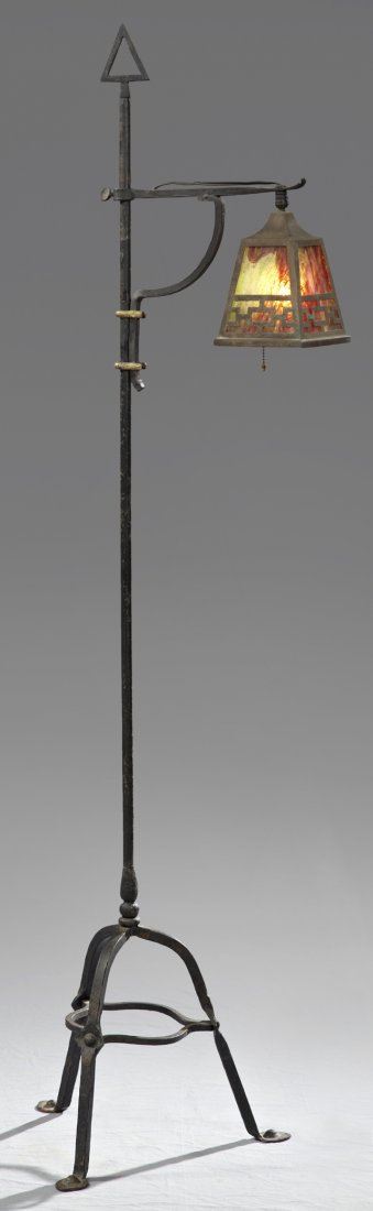 Wrought Iron Arts and Crafts Floor Lamp, c. 1910, with: Wrought Iron Arts and Crafts Floor Lamp, c. 1910, with a brass and slag glass shade, on tripodal legs, H.- 61 1/2 in., Dia.- 15 1/2 in..