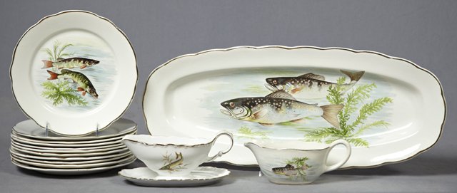 Thirteen Piece Ceramic Seafood Set, 20th c., by Sarragu: Thirteen Piece Ceramic Seafood Set, 20th c., by Sarraguemines, consisting of 11 plates, a sauce boat, and a fish platter, all with transfer fish decoration, together with an associated sauce boat on f
