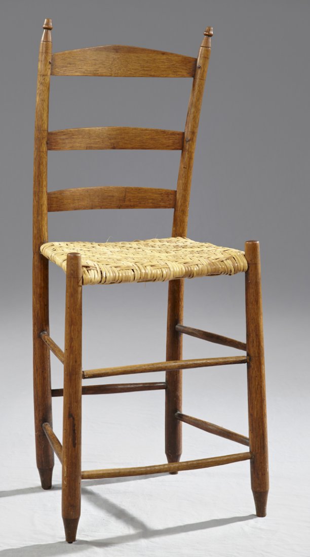 American Carved Mahogany Weaver's Chair, early 19th c.,: American Carved Mahogany Weaver's Chair, early 19th c., the arched crest rail over slats, to a woven rattan seat, on tapered turned legs joined by turned stretchers, on toupie feet, H.- 39 3/4 in.