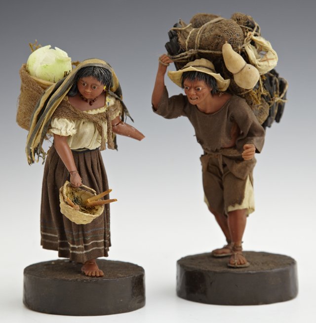 Pair of New Orleans Vargas Family Waxwork Figures, earl: Pair of New Orleans Vargas Family Waxwork Figures, early 20th c., consisting of a female Mexican vegetable seller, and a male Mexican wood seller, the female as found, on wooden plinths, on an ebonize