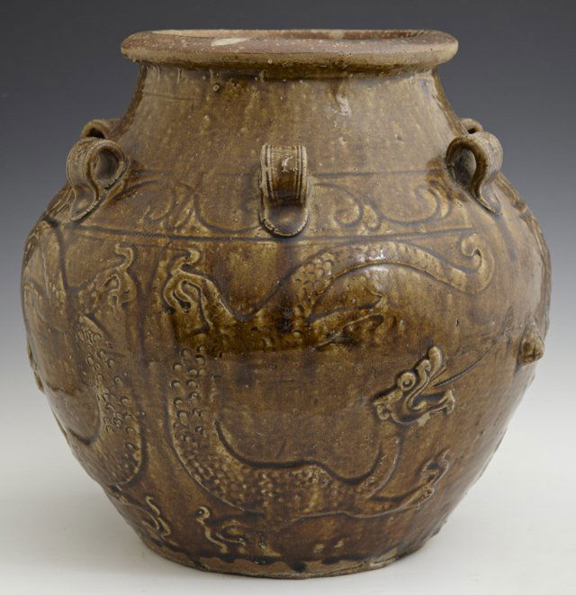 Chinese Brown Glazed Earthenware Baluster Water Pot, 19: Chinese Brown Glazed Earthenware Baluster Water Pot, 19th c., with six applied flat ring handles, the sides with incised decoration and relief dragons, H.- 12 in., D.- 15 in.