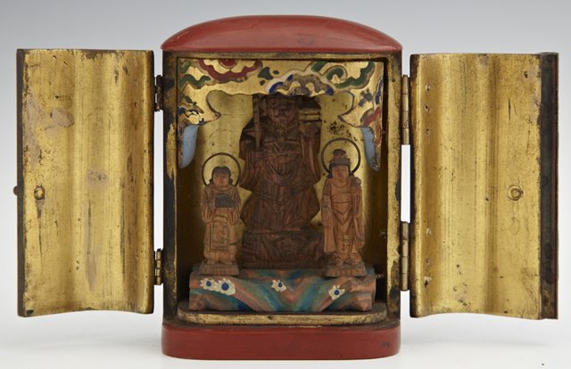 Unusual Oriental Papier Mache Miniature Shrine, early 2: Unusual Oriental Papier Mache Miniature Shrine, early 20th c., the gilded interior with three carved wooden deities, H.- 3 3/4 in., W.- 2 3/4 in., D.- 1 3/4 in.