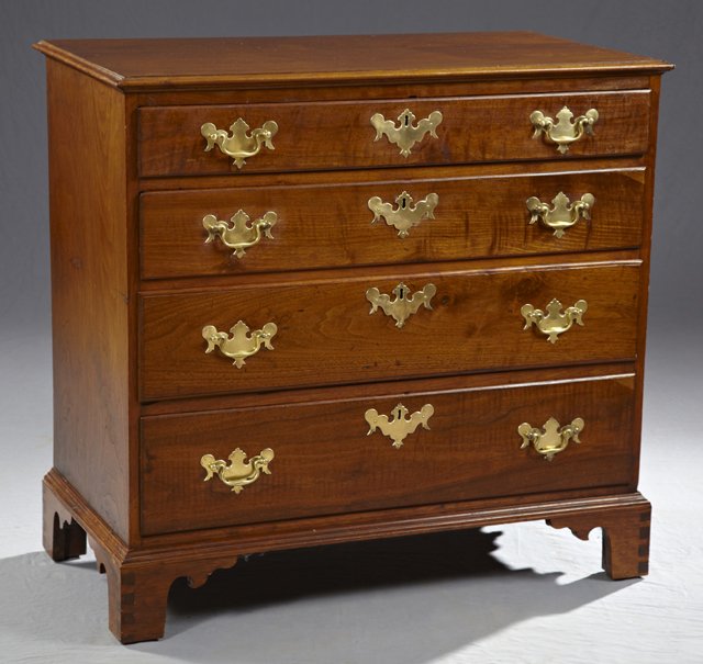 Southern Yellow Pine and Walnut Chest, 19th c., the oge: Southern Yellow Pine and Walnut Chest, 19th c., the ogee edge top over four graduated drawers with brass pulls and escutcheons, on a plinth base with bracket feet, H.- 36 in., W.- 38 1/2 in., D.- 19 3