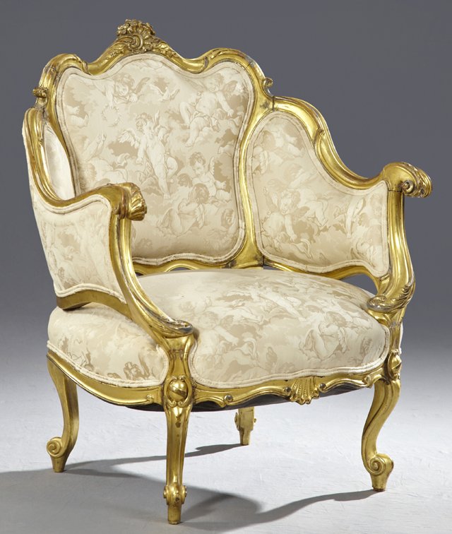 Napoleon III Giltwood Bergere, late 19th century, in th: Napoleon III Gilt Wood Bergere, late 19th century, in the Louis XV taste, the padded trisected back and sides surmounted by a shell and foliate crest, the padded seat raised on molded cabriole legs en