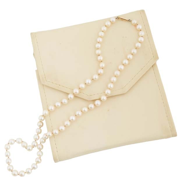 Graduated Strand of Cream Colored Pearls L.- 20 1/2 in.: Graduated Strand of Cream Colored Pearls ranging from 6mm to 7mm, with an 18K yellow gold clasp, L.- 20 1/2 in.