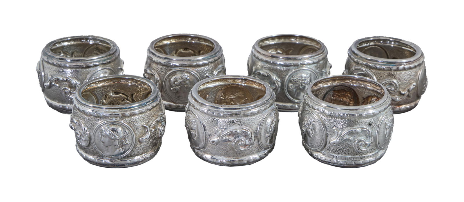 Set of Seven Galmer "Cameo" Neo Grecian Sterling Napkin Rings, 20th/21st c., App. Total Wt.- 8.64 (1 of 3)