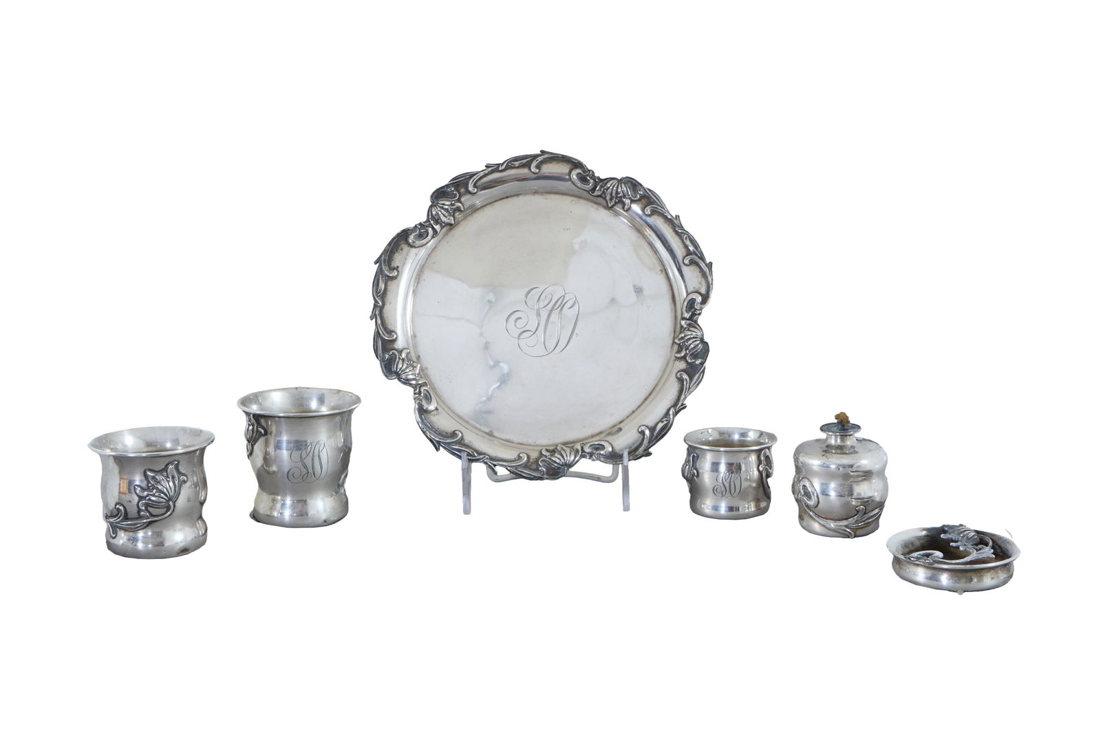 Six Piece Art Nouveau Sterling Applique on Sterling Smoking Group, c. 1900, App. Total Sterling Wt.-: Six Piece Art Nouveau Sterling Applique on Sterling Smoking Group, c. 1900, by William B. Kerr & Co., Newark, set number 378, consisting of a circular tray, a lighter, an ashtray, 3 cigarette cups, ea