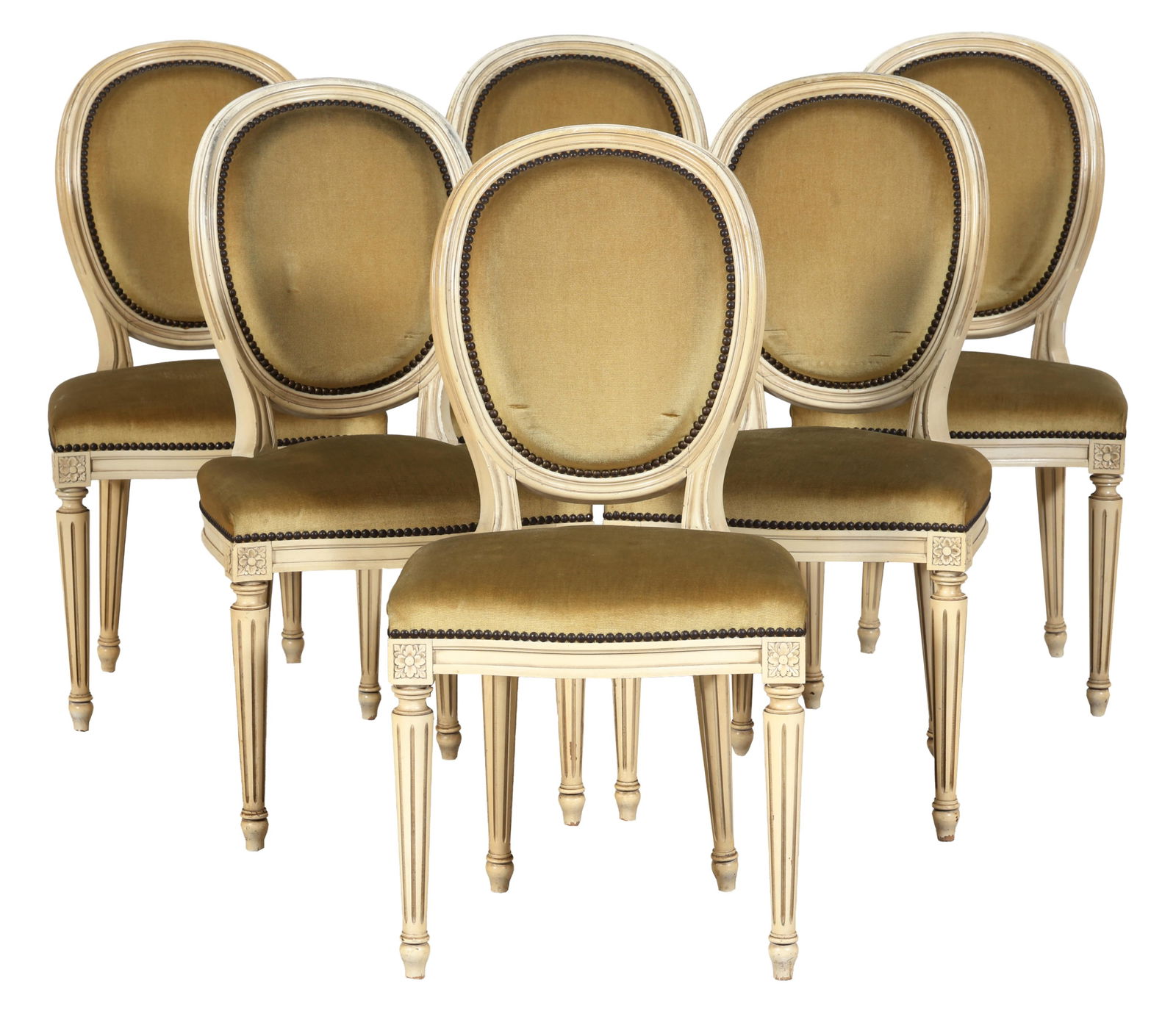 Six French Louis XVI Style Creme Peinte Dining Chairs, 20th c., Each- H.- 36 1/2 in., W.- 18 1/2: Six French Louis XVI Style Creme Peinte Dining Chairs, 20th c., the upholstered oval backs over serpentine seats, rosette blocks, spool turned fluted tapered legs, toupie feet, Each- H.- 36 1/2 in., W