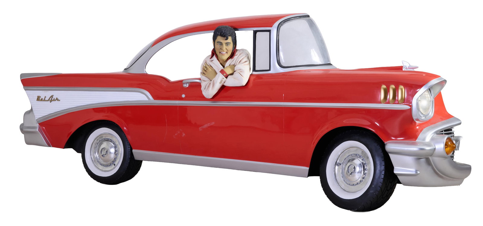Large Wall Sculpture/Display of Elvis Presley in a Chevy Bel Air, 20th c., Car- H.- 40 in., W.- 120: Large Wall Sculpture/Display of Elvis Presley in a Chevy Bel Air, 20th c., polychromed fiberglass car inset with lights, with conforming removable bust of Elvis, Car- H.- 40 in., W.- 120 in., D.- 15 i