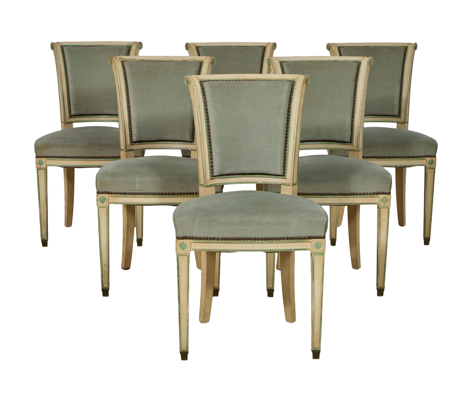 Six French Directoire Style Creme Peinte Dining Chairs, early 20th c., H.- 33 1/2 in., W.- 18 1/2: Six French Directoire Style Creme Peinte Dining Chairs, early 20th c., the scrolled upholstered backs over upholstered seat, rosette blocked seat rail, tapered legs with brass caps, H.- 33 1/2 in., W.