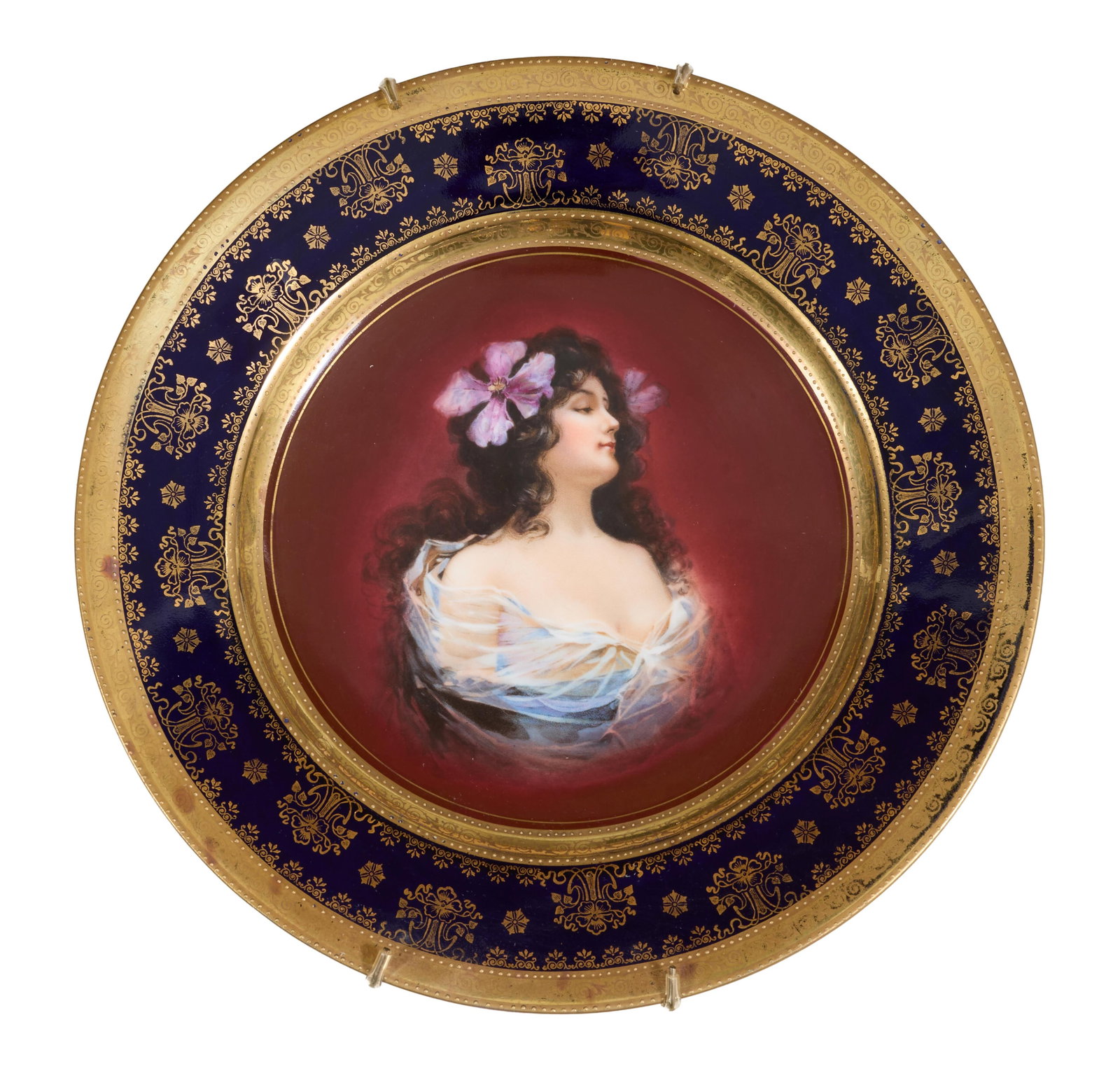Royal Vienna Porcelain Portrait Plate, 19th c., H.- 1 1/8 in., Dia.- 9 7/8 in.: Royal Vienna Porcelain Portrait Plate, 19th c., with a wide gilt tracery border and a gilt rim around a hand painted reserve of a beauty with purple flowers in her hair, verso with a blue beehive mark