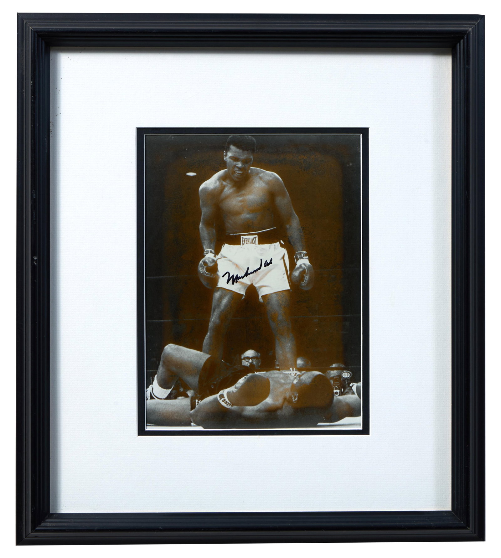 Muhammad Ali Autographed Photo of the Sonny Liston Knockout (1965), Sight- H.- 9 3/8 in., W.- 6 3/4: Muhammad Ali Autographed Photo of the Sonny Liston Knockout (1965), silver gelatin print, signed, presented in a black wood frame, Sight- H.- 9 3/8 in., W.- 6 3/4 in., Framed- H.- 17 1/8 in., W.- 15 1