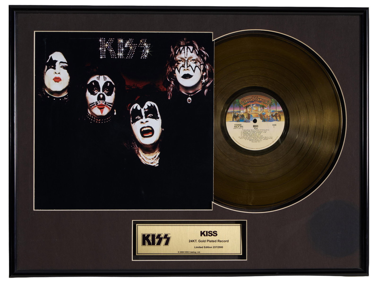 KISS Album Memorabilia, Overall- H.- 18 1/2 in., W.- 24 1/4 in.: KISS Album Memorabilia, limited edition "237/2500", with 24K gold-plated Casablanca LP and a copy of the original album cover, and a gold commemorative plaque, with a certificate by Photo File, presen