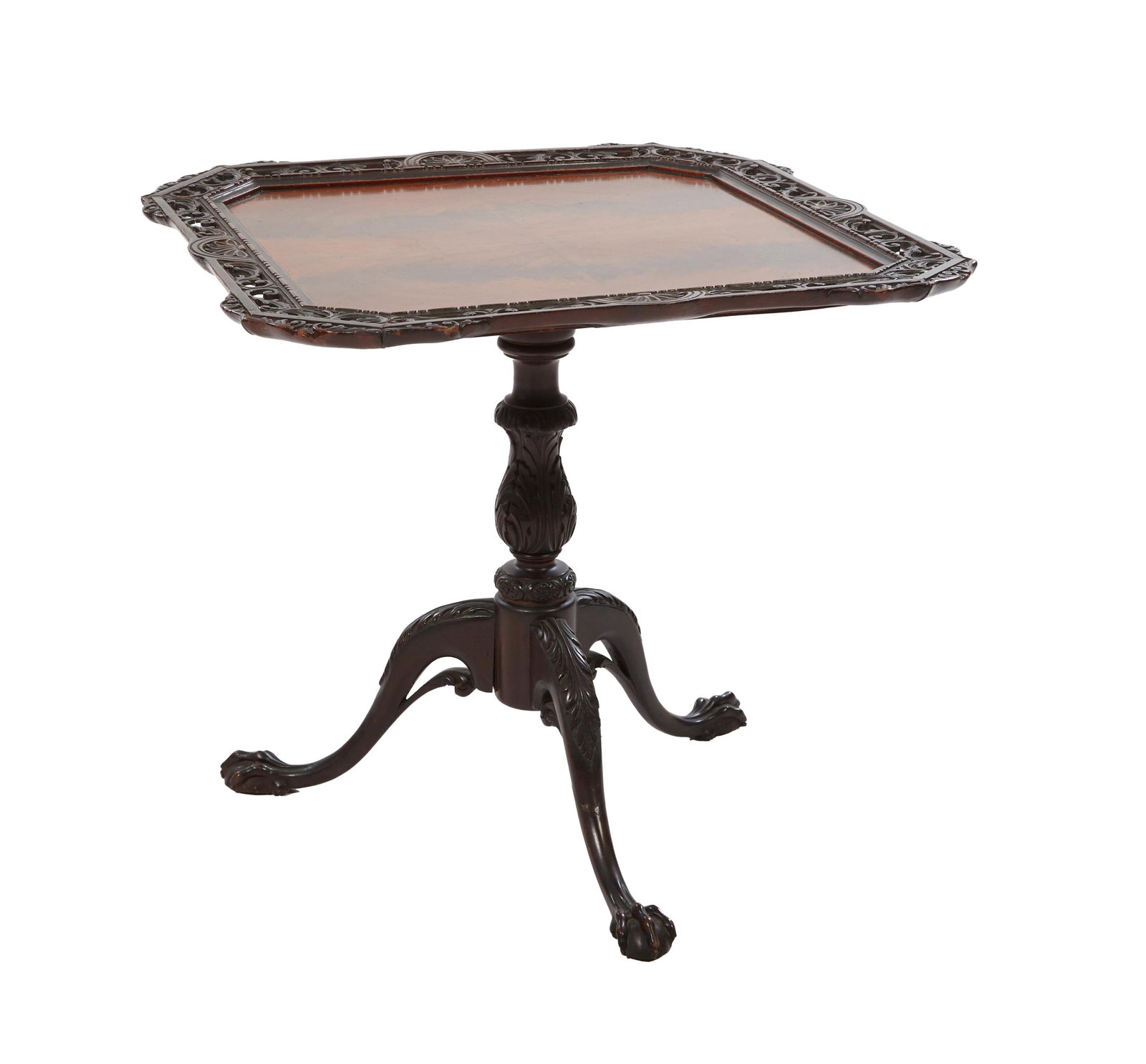 Irish Style Carved Mahogany Tea Table, 20th c., H.- 28 1/2 in., W.- 31 1/2 in., D.- 31 1/2 in.: Irish Style Carved Mahogany Tea Table, 20th c., the book matched canted corner top, with a fan carved pierced scrolled surround, on an acanthus vasiform standard, with acanthus carved tripodal legs, w