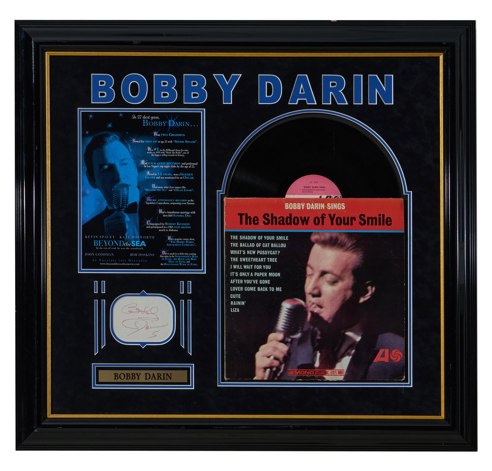 Bobby Darin "Shadow of Your Smile" Autographed Memorabilia, H.- 29 3/8 in., W.- 31 3/4 in.: Bobby Darin "Shadow of Your Smile" Autographed Memorabilia, signed paper with plaque, LP and album cover, and listing of awards with picture singing, presented in a black frame with plexiglass, H.- 29
