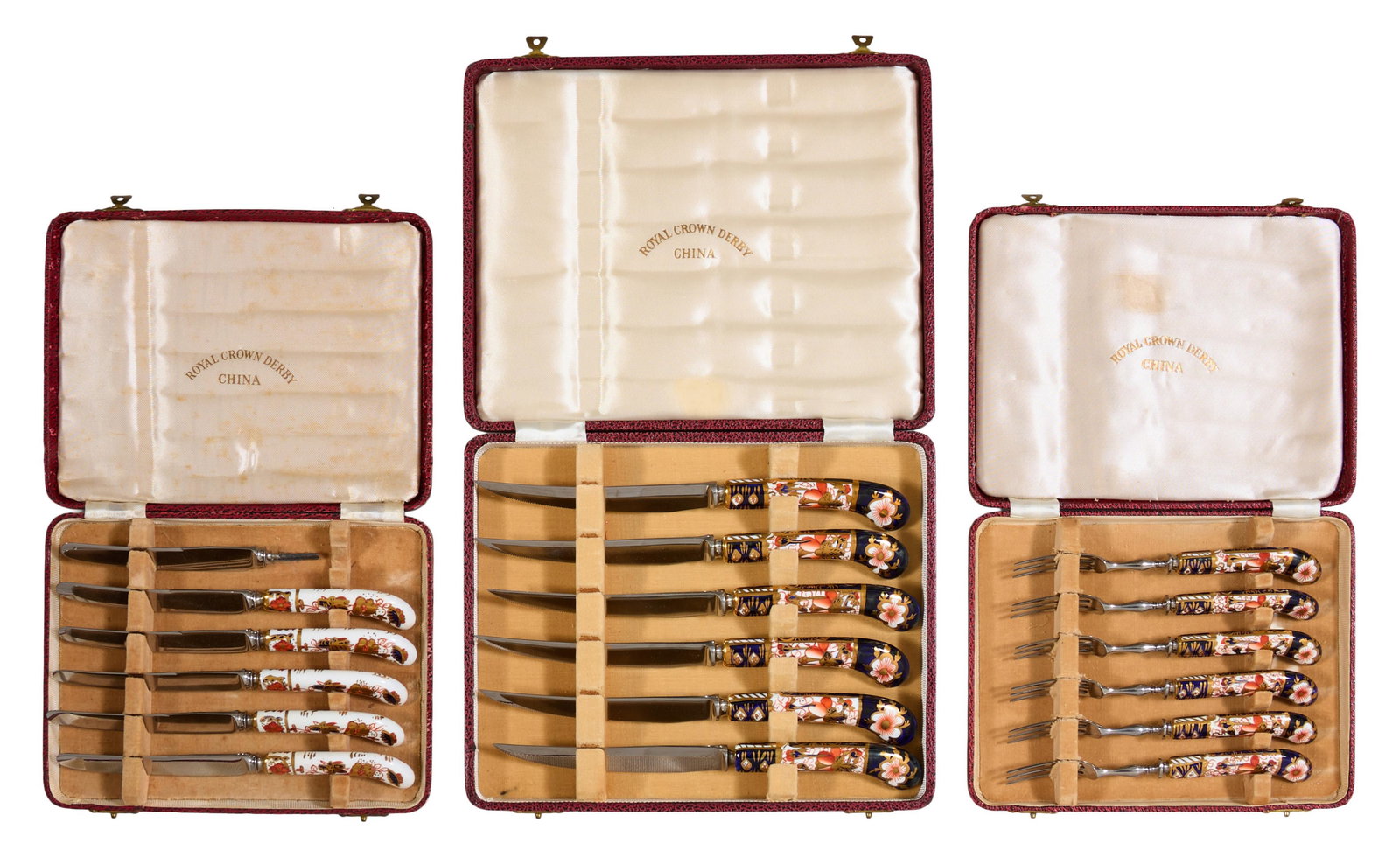 Three Cased Sets of Royal Crown Derby Porcelain-Handled Cutlery, early 20th c., Steak Knife- L. 8: Three Cased Sets of Royal Crown Derby Porcelain-Handled Cutlery, early 20th c., consisting of six steak knives, five butter knives, and six cocktail forks, each presented in a leatherette case, Steak 