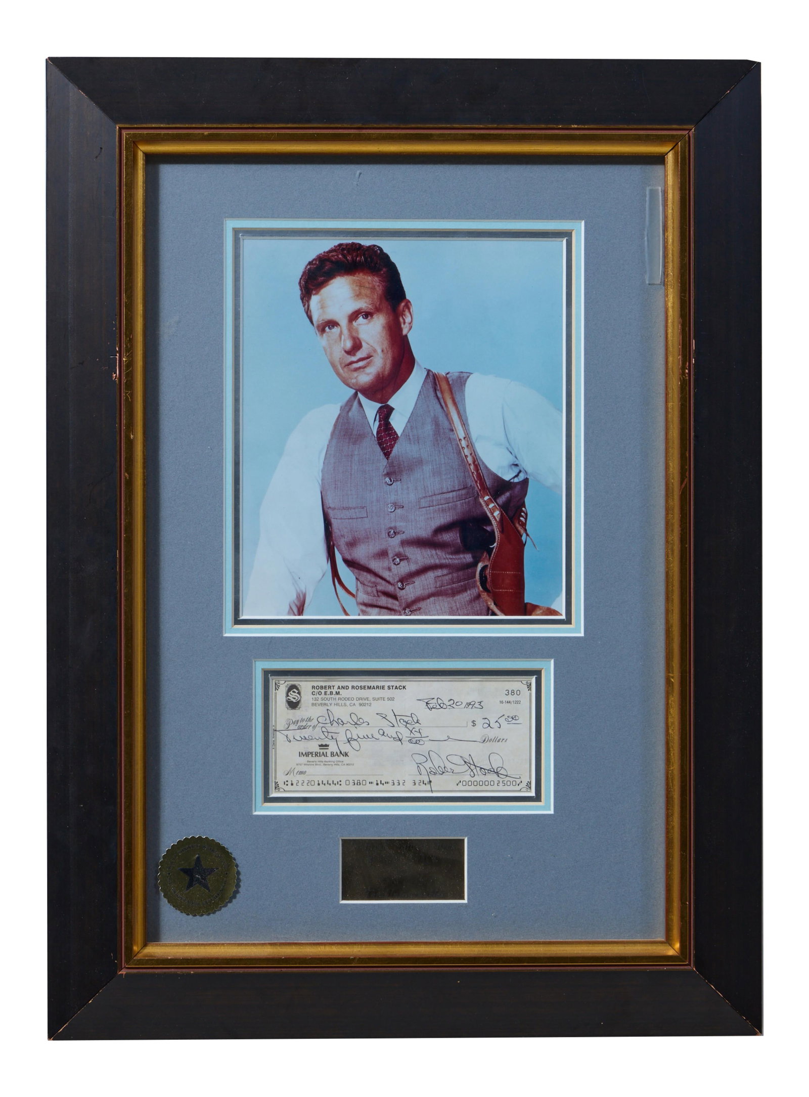 Robert Stack Autographed Memorabilia, Overall- H.- 22 in., W.- 16 in.: Robert Stack Autographed Memorabilia, with a 1993 signed check, Hollywood shot as Eliot Ness in the "Untouchables" (1953-1963), and an actor's plaque, presented in a giltwood frame with a Walt Disney 