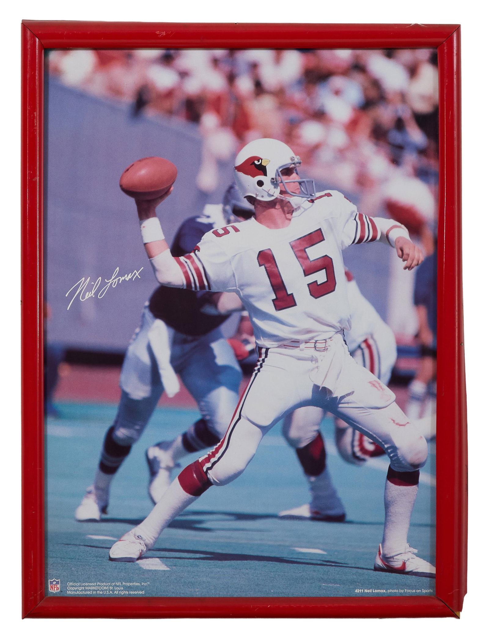 Neil Lomax Autographed NFL Memorabilia, Overall- H.- 31 in., W.- 23 in.: Neil Lomax Autographed NFL Memorabilia, as quarterback for the Cardinals, poster on board, signed in print, presented in a red wood frame, Overall- H.- 31 in., W.- 23 in. Provenance: The Estate of Jos