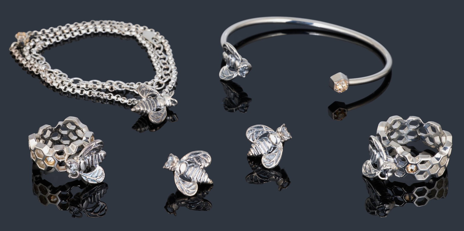 Seven Piece Sterling Mignon Faget "Hive" Series Set, App. Total Wt.- 50.3 grams; Bracelet- Dia.- 2: Seven Piece Sterling Mignon Faget "Hive" Series Set, consisting of a chain necklace with a honeybee pendant, a pair of honeybee stud earrings, a honeybee wire bracelet, and two honeycomb form rings, A