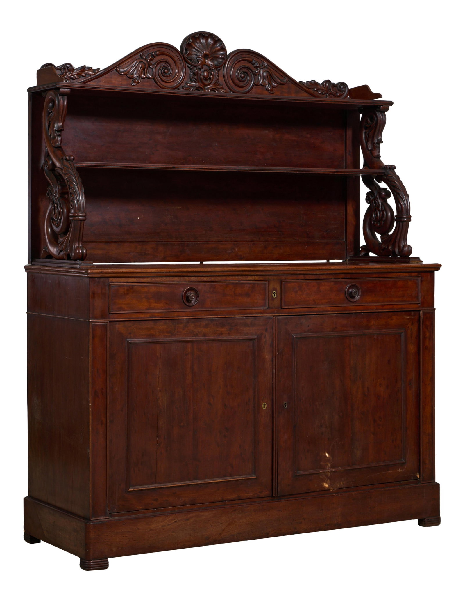 French Napoleon III Plum Pudding Mahogany Saint Hubert Sideboard, late 19th c., H.- 72 5/ 8 in., W.-: French Napoleon III Plum Pudding Mahogany Saint Hubert Sideboard, late 19th c., the superstructure with carved shell and foliate scroll brackets, two moulded shelves, relief carved pierced 'S' scroll 