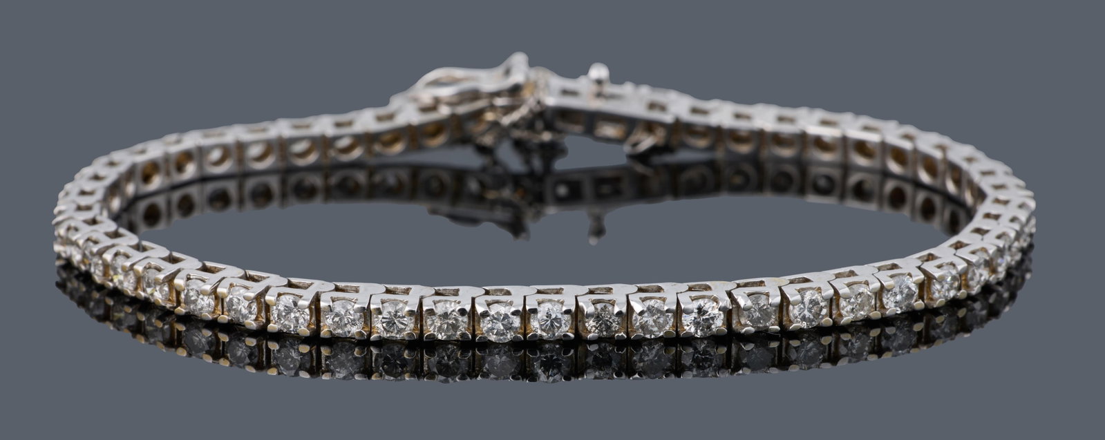 14K White Gold Diamond Tennis Bracelet, App. Total Wt.- 11.9 grams, L.- 7 1/8 in.: 14K White Gold Diamond Tennis Bracelet, set with approximately 3.00 carats total weight diamonds, safety chain, App. Total Wt.- 11.9 grams, L.- 7 1/8 in. Please Note: All assessments of gemstone weigh