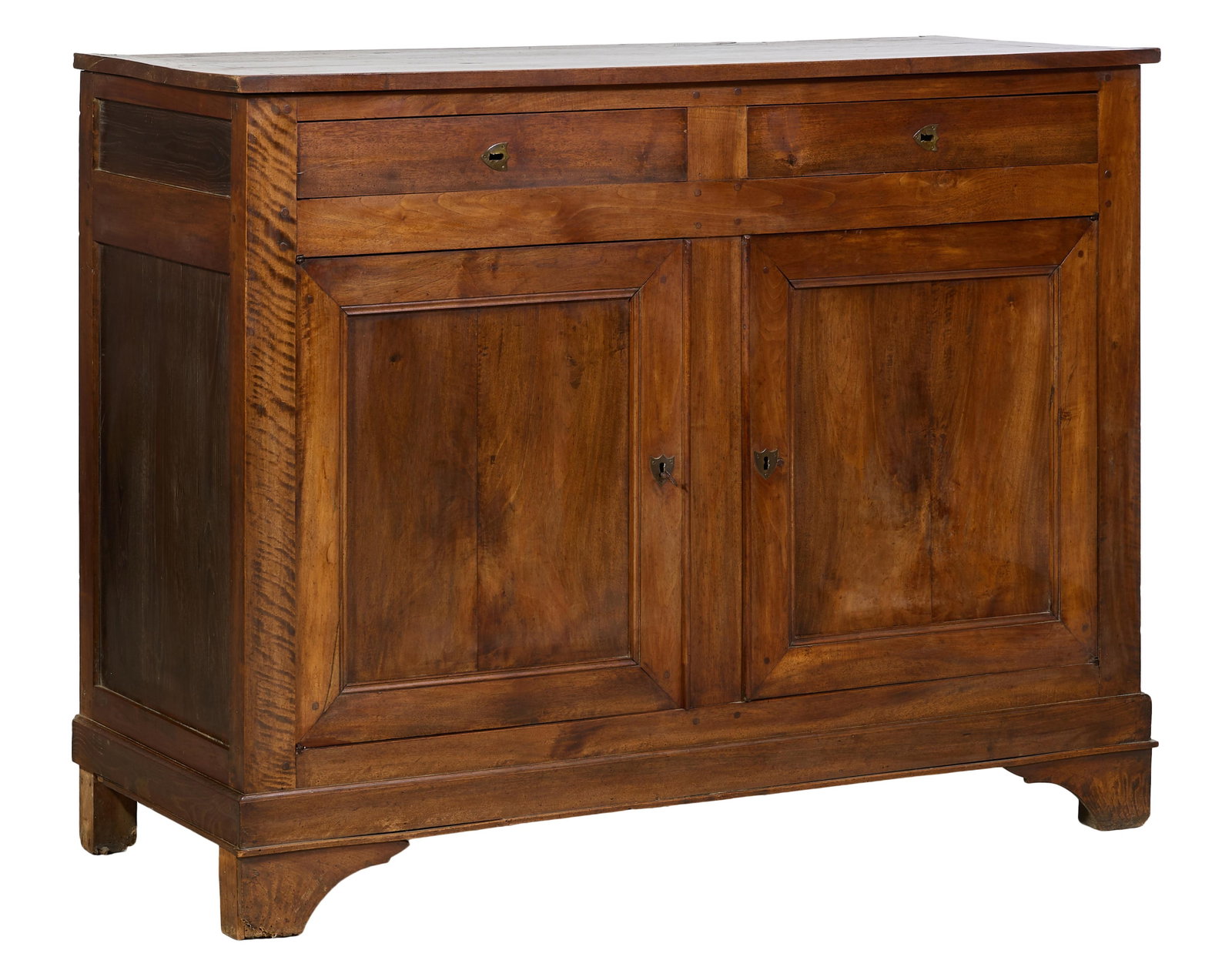 French Louis Philippe Walnut Sideboard, mid 19th c., H.- 46 in., W.- 59 1/8 in., D.- 24 in.: French Louis Philippe Walnut Sideboard, mid 19th c., the rectangular top over two setback frieze drawers above two cabinet doors, on a stepped base with bracket feet, H.- 46 in., W.- 59 1/8 in., D.- 2