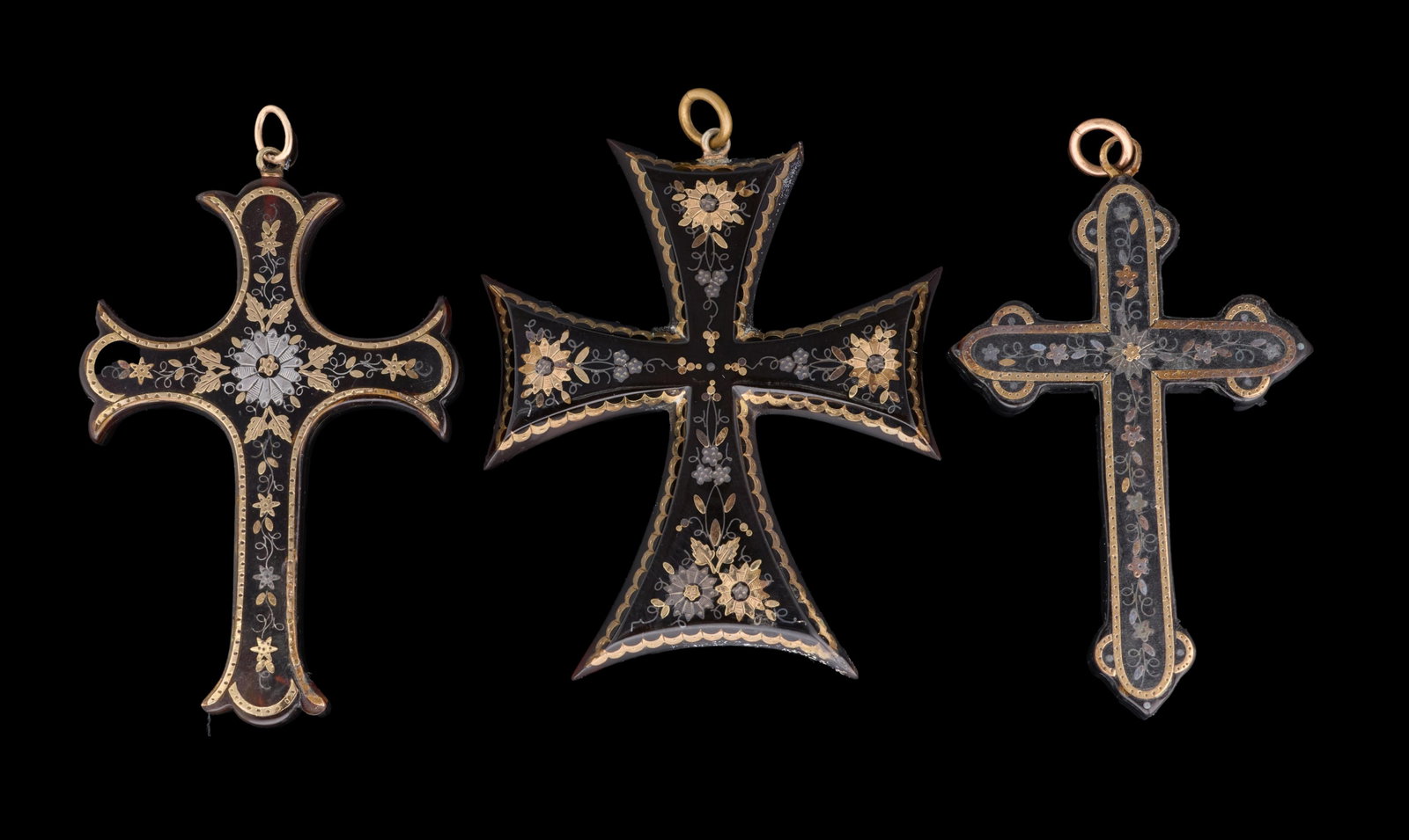 Three Pique Cross Pendants, 19th c., App. Total Wt.- 15.3 grams; Largest- H.- 2 1/2 in., W.- 1 7/8: Three Pique Cross Pendants, 19th c., each cross variously formed and bearing precious metal inlay, App. Total Wt.- 15.3 grams; Largest- H.- 2 1/2 in., W.- 1 7/8 in. (3 Pcs.) Please Note: All assessmen