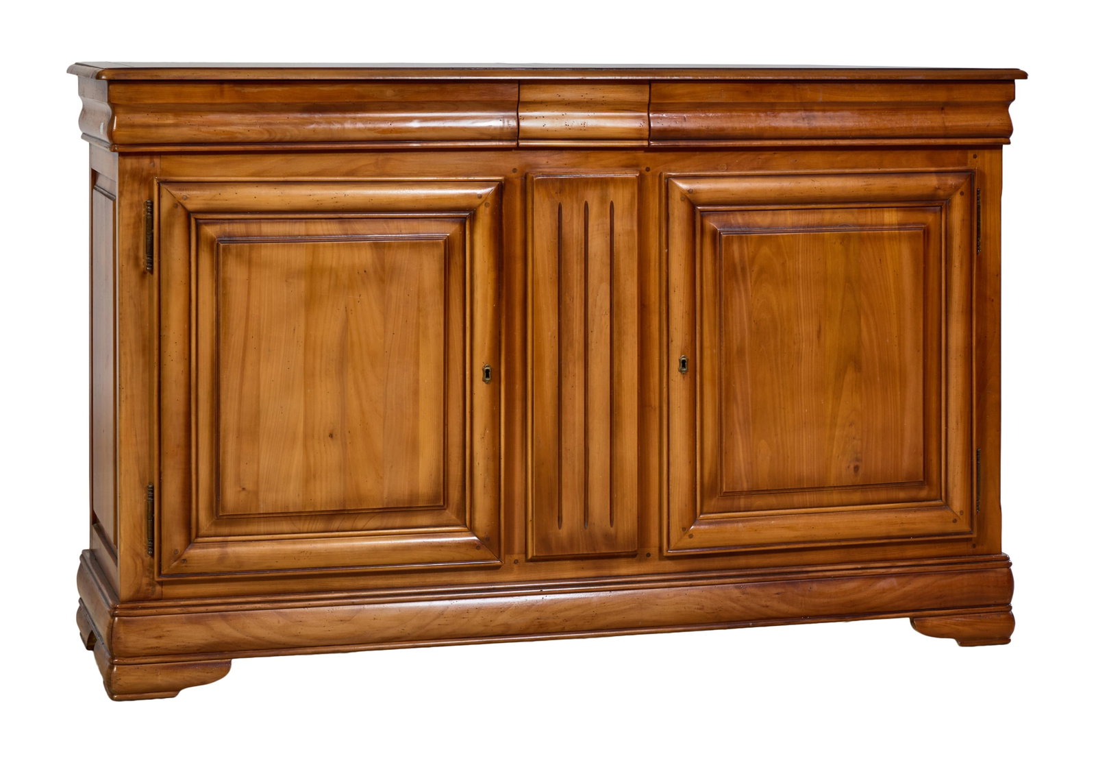 French Louis Philippe Style Cherry Sideboard, mid 20th c., H.- 41 3/4 in., W.- 67 in., D.- 20 in.: French Louis Philippe Style Cherry Sideboard, mid 20th c., the rectangular top with rounded corners, two cyma frieze drawers, two raised pane doors with fluted centra panel, moulded base bracket feet,