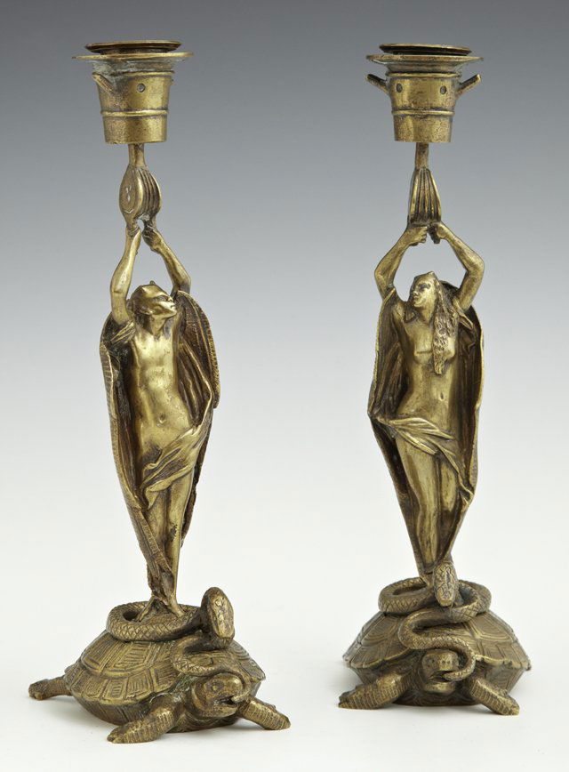 Unusual Pair of French Bronze Candlesticks, late 19th: Unusual Pair of French Bronze Candlesticks, late 19th c., of nude angels standing on turtles' backs entwined with snakes, upholding bellows based candle cups, H.- 9 1/2 in., W.- 2 3/4 in., D.- 3 3/4 i