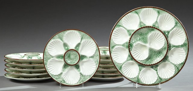 Thirteen Piece Ceramic Oyster Set, early 20th c., by: Thirteen Piece Ceramic Oyster Set, early 20th c., by Longchamps, consisting of 12 plates and a large serving platter, Plates- H.- 1 in., Dia.- 9 1/2 in.