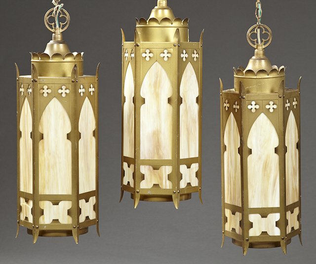Group of Three Gothic Style Gilt Iron Hexagonal Slag: Group of Three Gothic Style Gilt Iron Hexagonal Slag Glass Hanging Lights, 20th c., with caramel glass panels, one light lacking two glass panels, H.- 29 1/2 in., Dia.- 10 1/2 in.