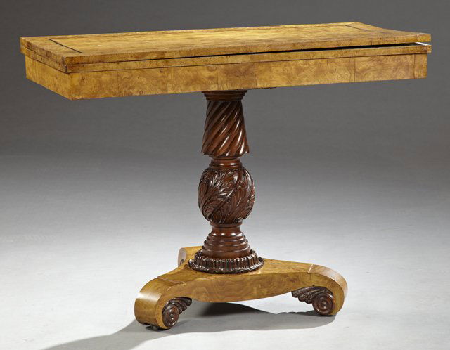 English Ebony Inlaid Burled Maple Games Table, 19th c.,: English Ebony Inlaid Burled Maple Games Table, 19th c., on an acanthus carved baluster support to a tripartite base with scrolled feet, H.- 28 3/4 in., W.- 38 in., D.- Closed- 18 1/2 in., Open- 37 in.
