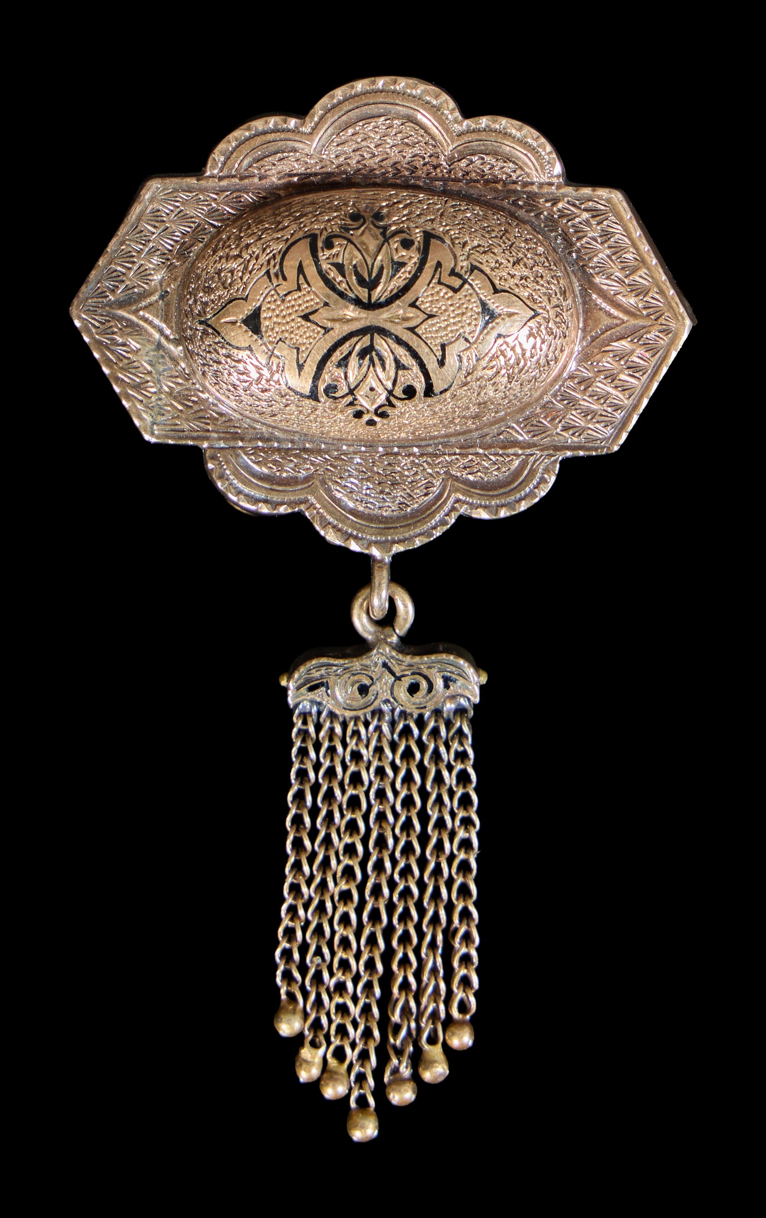 14K Yellow Gold Taille d'Epargne Brooch, 19th c., App. Total Wt.- 6.2 grams, H.- 2 1/2 in., W.- 1: 14K Yellow Gold Taille d'Epargne Brooch, 19th c., with incised and enamel decoration, suspending a lower like decorated pendant with seven tiny link tassels, App. Total Wt.- 6.2 grams, H.- 2 1/2 in., 
