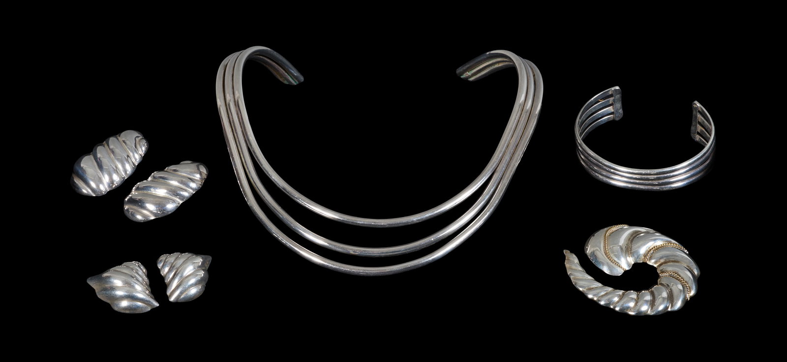 Seven Pieces of Sterling Jewelry, App. Total Wt.- 5.60 Troy oz.; Necklace- Int. W.- 5 1/8 in.;: Seven Pieces of Sterling Jewelry, consisting of 5 pieces of Mexican Taxco jewelry, including two pairs of earrings and a brooch, all with puffed, ribbed shell-form design; together with a Georg Jensen