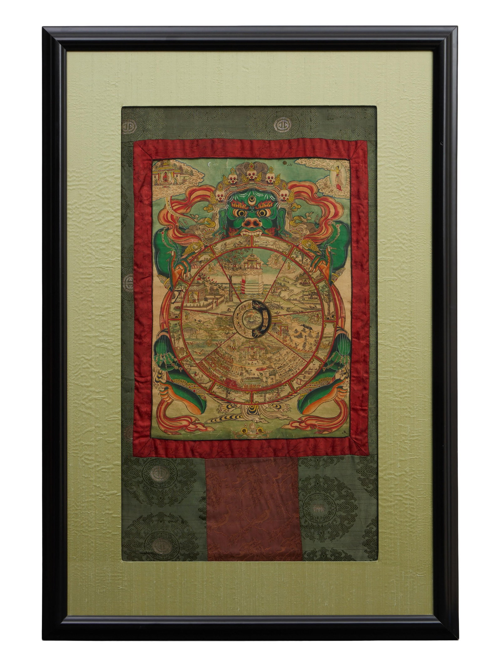 Tibetan Wheel of Life Thanka, 19th/20th c., Image- H.- 21 1/2 in., W.- 15 1/4 in., Framed- H.- 47: Tibetan Wheel of Life Thanka, 19th/20th c., ink and color on paper, mounted on silk, presented in a black frame, Image- H.- 21 1/2 in., W.- 15 1/4 in., Framed- H.- 47 3/4 in., W.- 32 1/2 in.