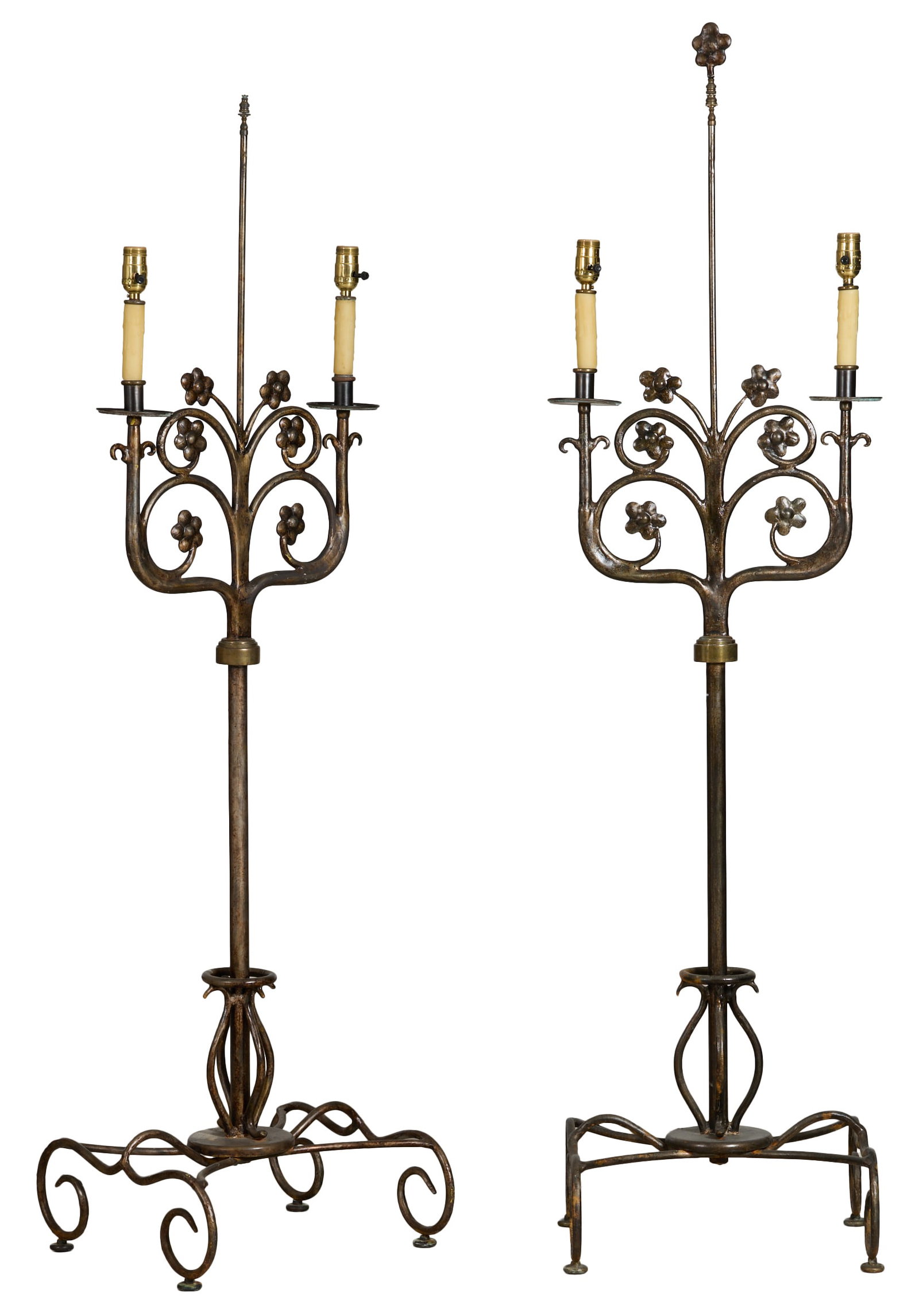 Pair of Spanish Style Wrought Iron Floor Candelabra, late 20th c., Each- H.- 62 5/8 in., W.- 18 in.,: Pair of Spanish Style Wrought Iron Floor Candelabra, late 20th c., the central floral vine flanked by two candle arms, central standard over scrolled base, Each- H.- 62 5/8 in., W.- 18 in., D.- 16 1/2