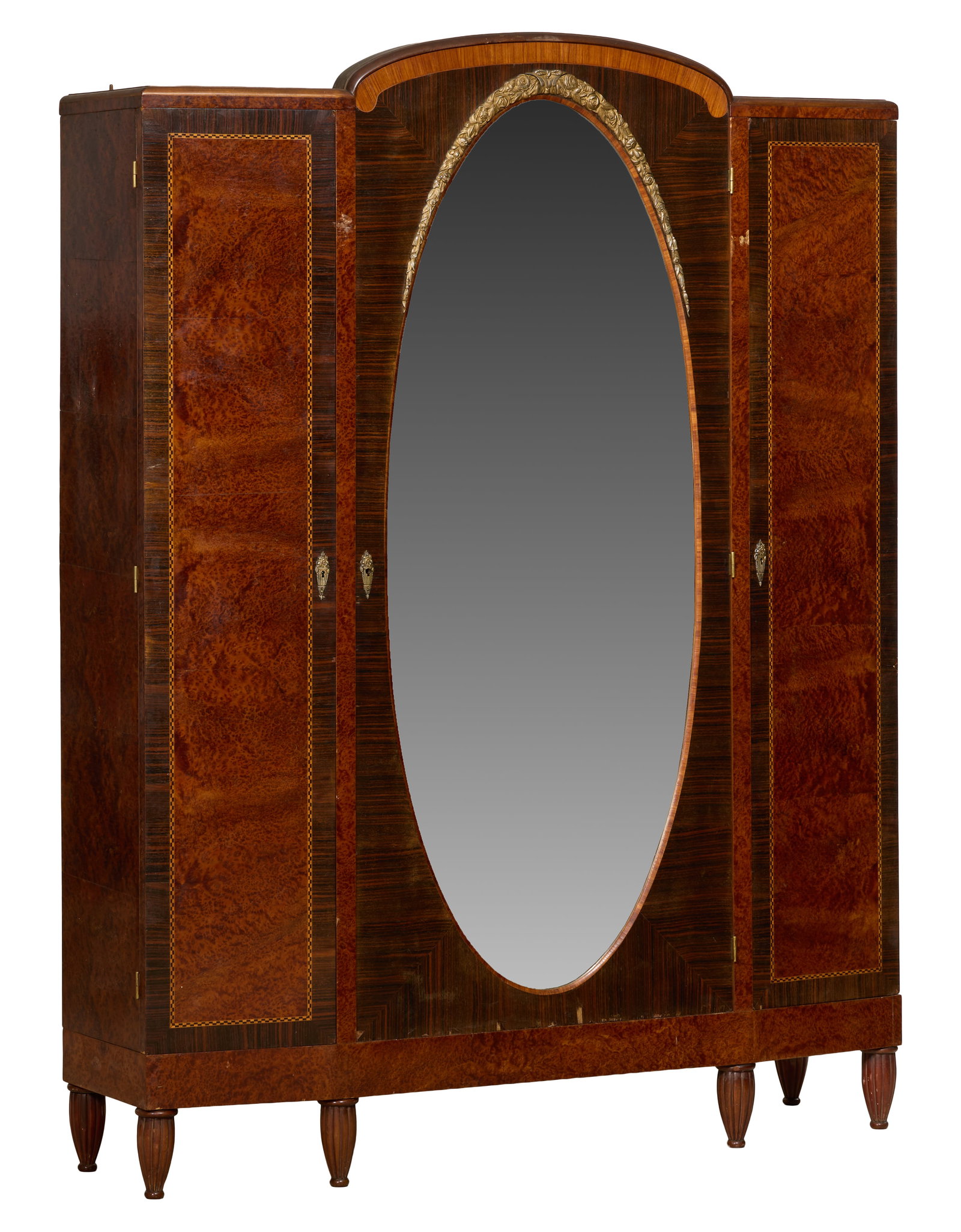 French Art Nouveau Parquetry and Burl Armoire, early 20th c., H.- 82 1/2 in., W.- 63 in., D.- 16 in.: French Art Nouveau Parquetry and Burl Armoire, early 20th c., the arched inlaid scroll crest over floral swag mounted oval mirrored door, flanked by two string inlaid burled side doors, reeded tapered