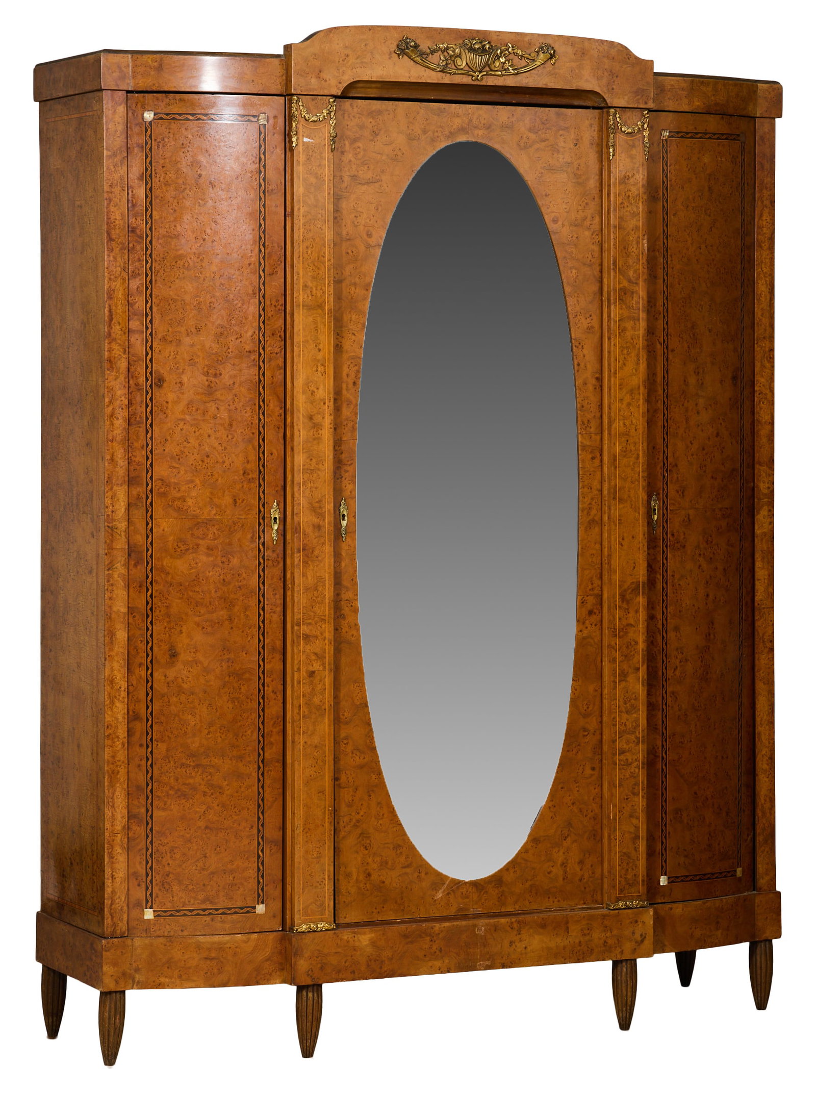 French Art Nouveau Inlaid Burled Walnut Armoire, early 20th c., H.- 89 1/2 in., W.- 70 in., D.- 20: French Art Nouveau Inlaid Burled Walnut Armoire, early 20th c., the spandrel arched mounted center over oval mirror door, flanked my inlaid mounted stiles, shaped inlaid burled side doors, conforming 