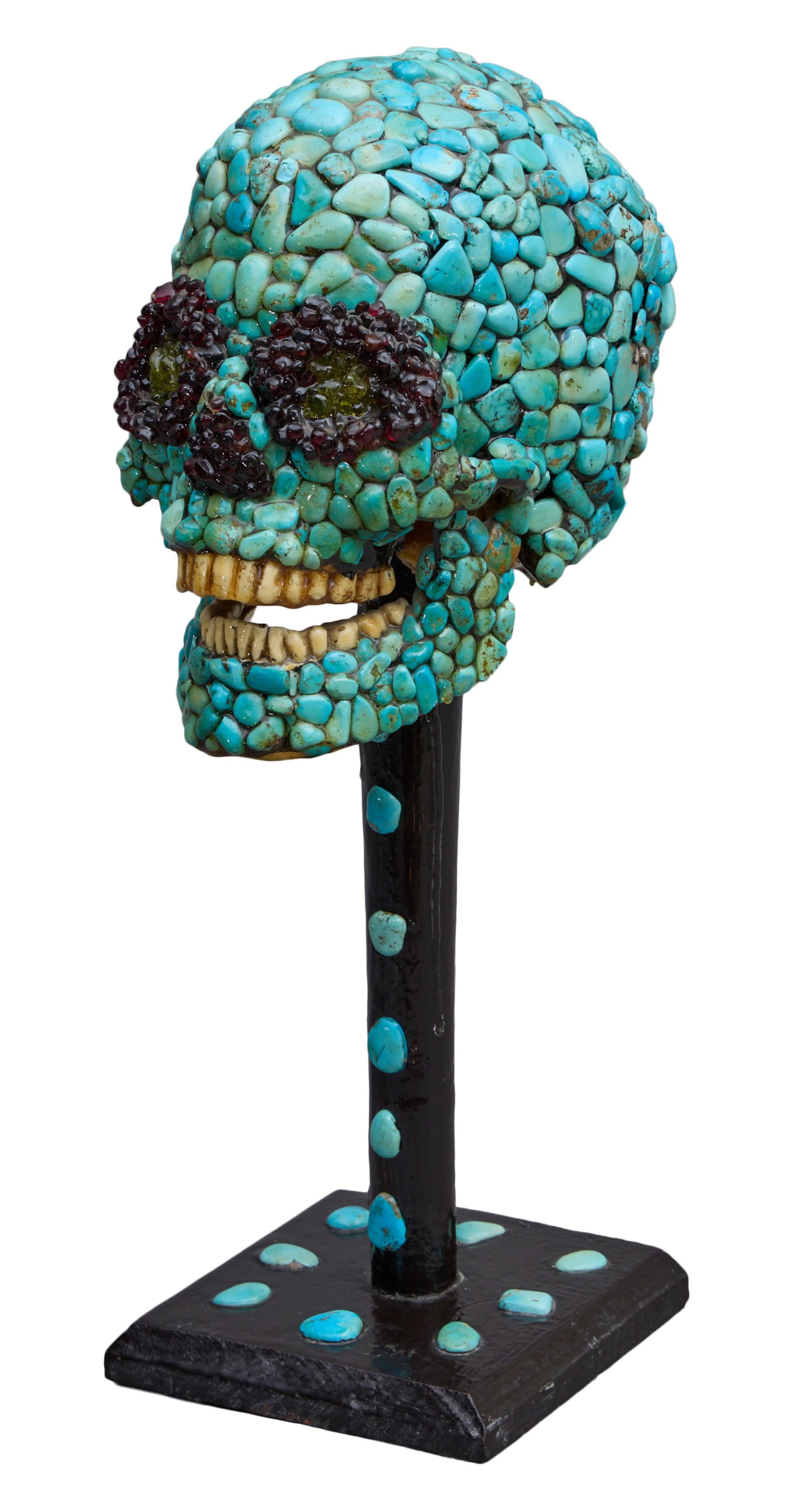 Turquoise and Glass Mosaic Skull, 20th c., H.- 16 in., W.- 5 1/2 in., D.- 7 in.: Turquoise and Glass Mosaic Skull, 20th c., on a wooden stand with turquoise cabochons, H.- 16 in., W.- 5 1/2 in., D.- 7 in. Provenance: The Estate of Joseph A. Jaeger, Jr., New Orleans, LA.