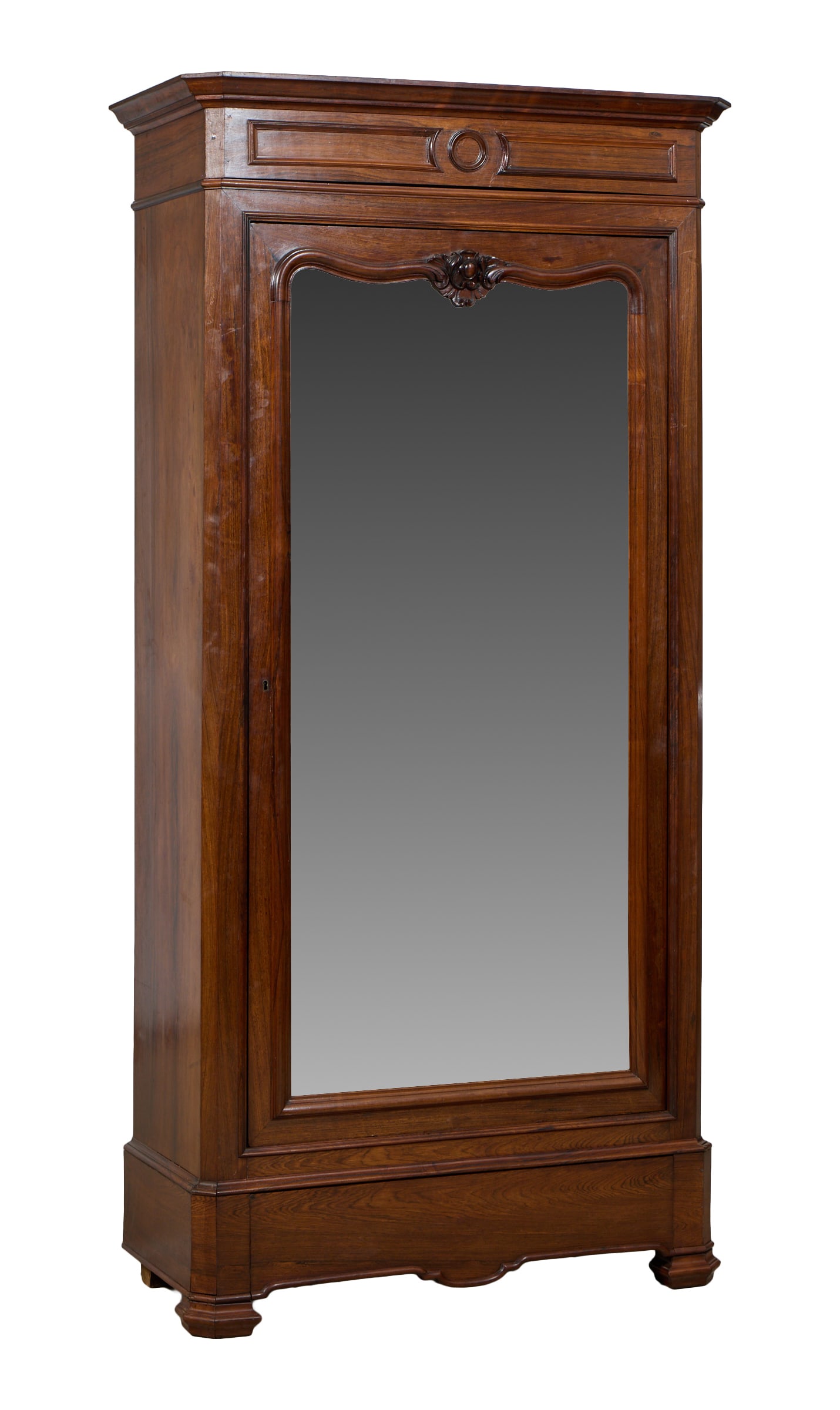 French Napoleon III Walnut Bonnetiere, late 19th c., H.- 88 1/4 in., W.- 45 in., D.- 19 1/2 in.: French Napoleon III Walnut Bonnetiere, late 19th c., the molded cornice with canted corners, strap work frieze, mirrored door with floral carved crest, lower base drawer, shaped feet, H.- 88 1/4 in., 