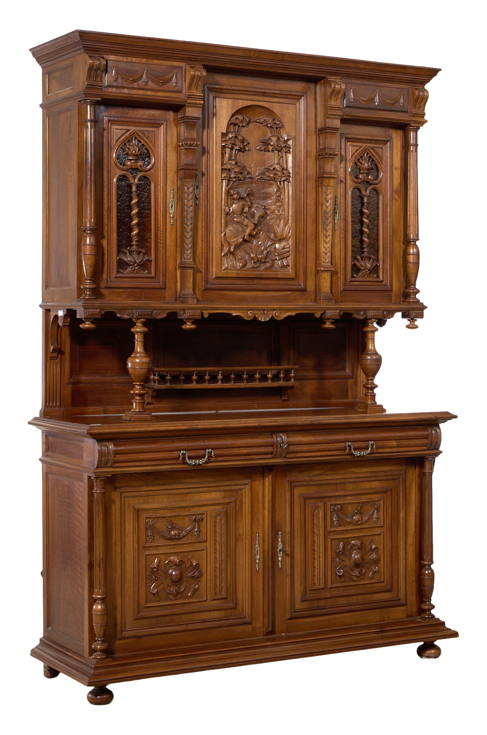 French Renaissance Revival Carved Walnut Buffet a Deux Corps, late 19th c., H.- 93 in., W.- 63 in.: French Renaissance Revival Carved Walnut Buffet a Deux Corps, late 19th c., the architectonic superstructure with central scenic relied carved doors, flanked my pierced side doors with dark amber dapp