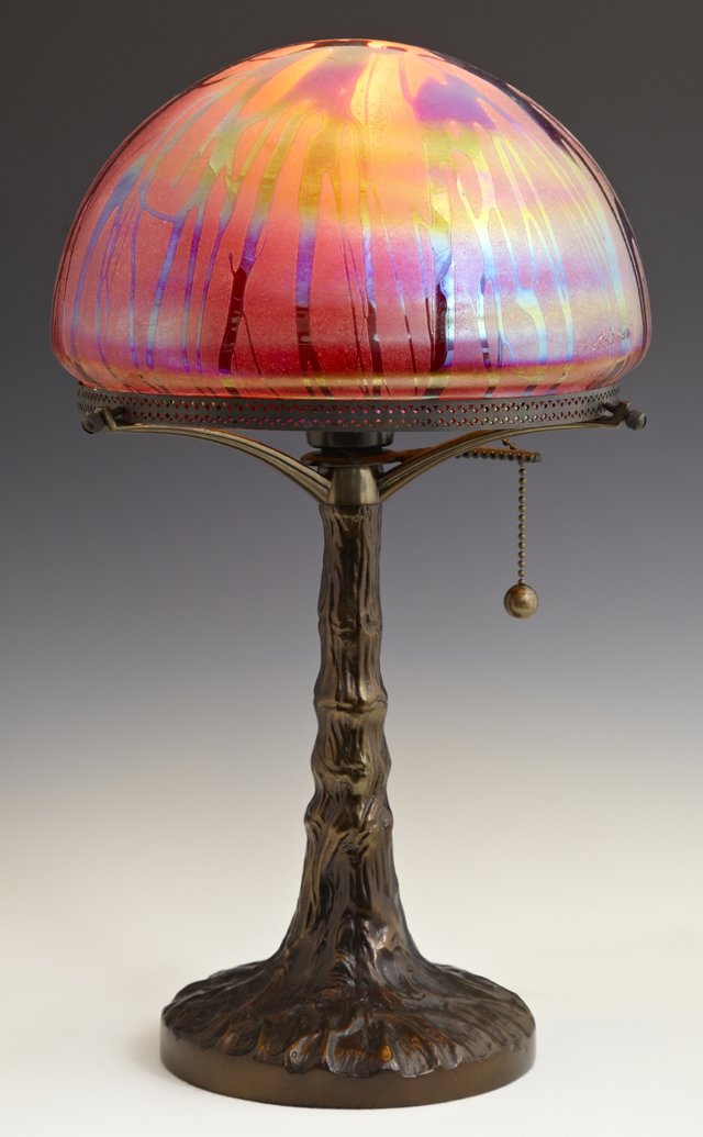 Art Glass Table Lamp, 21st c., by Quoisel, on a: Art Glass Table Lamp, 21st c., by Quoisel, on a patinated tree trunk base, the domed shade signed Todd Phillips, 2002 of the Salamander Glass Studio, H.- 16 3/4, Dia.- 10 in.