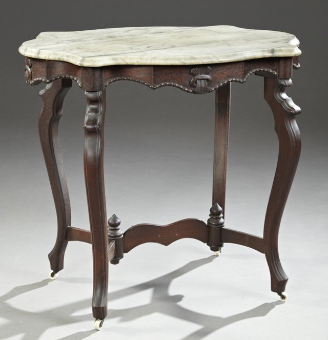 American Carved Mahogany Tortoise Marble Top Center: American Carved Mahogany Tortoise Marble Top Center Table, late 19th c., the ogee edge highly figured white marble, on a base with relief leaf and ring carving, on reeded cabriole legs, joined by a sh
