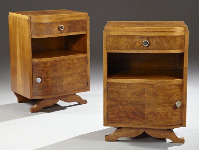 Pair of Art Deco Carved Walnut Nightstands, c. 1930, of: Pair of Art Deco Carved Walnut Nightstands, c. 1930, of undulating form, with a frieze drawer over open storage and a lower cupboard, on splayed trestle feet, H.- 25 1/2 in., W.- 18 in., D.- 14 in.