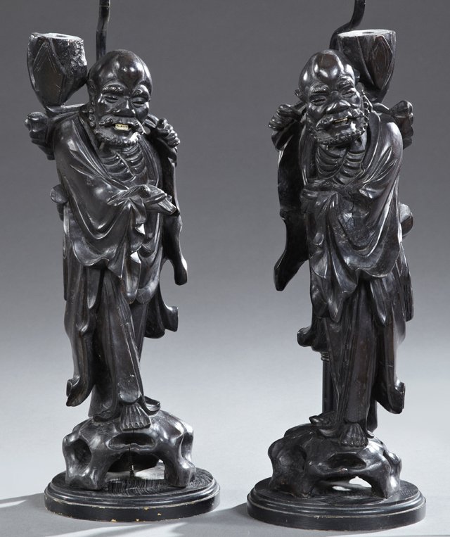 Pair of Chinese Carved Hardwood Figures, early 20th c.,: Pair of Chinese Carved Hardwood Figures, early 20th c., on pierced integral bases, now mounted on stepped ebonized wood bases as lamps, H.- 18 in., W.- 6 in., D.- 7 in.