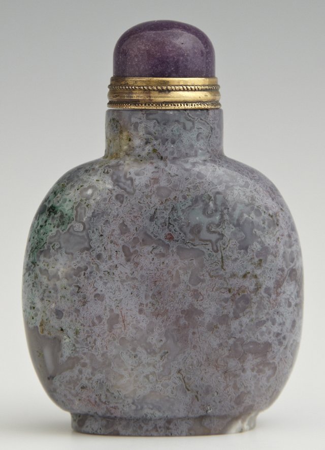 Chinese Moss Agate Footed Snuff Bottle, c. 1900, of: Chinese Moss Agate Footed Snuff Bottle, c. 1900, of flattened rounded form, with a purple stone stopper, from the Christian collection, H.- 2 5/8 in., W.- 1 7/8 in., D.- 1 in.