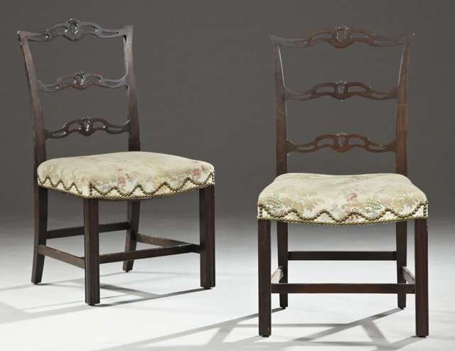 Pair of Carved Mahogany Chippendale Style Upholstered: Pair of Carved Mahogany Chippendale Style Upholstered Side Chairs, early 20th c., with pierced ladder backs over brass tack upholstered seats, on reeded square legs, joined by rectangular stretchers, 