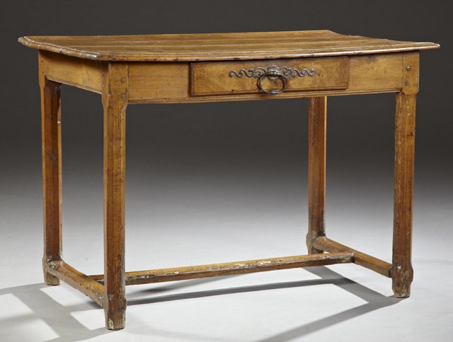 French Provincial Carved Oak Writing Table, mid 19th: French Provincial Carved Oak Writing Table, mid 19th c., three board top over central frieze drawer with a steel ring pull centering a long escutcheon, the whole on chamfered legs joined by rectangula